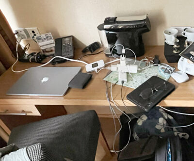 Messy wires on hotel desk